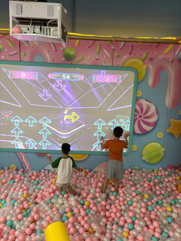 Children playing in an indoor ball pit at a playground in Ho Chi Minh City